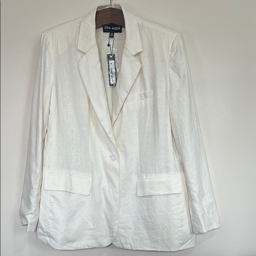 NWT Steve Madden Women's White Linen Blazer  
Key Details:  
Brand: Steve Madden  
Size and Size Locale: M, US  
Department: Women's  
Color: White  
Category: Blazer  
Length: 30.625 inches  
Material: 55% Linen, 45% Viscose  
Care Instructions: Hand wash only  
Origin: Imported  
Pattern: Solid  
Season: Spring/Summer  
Occasion: Casual to formal  
Special Features: Single button closure, easy fit