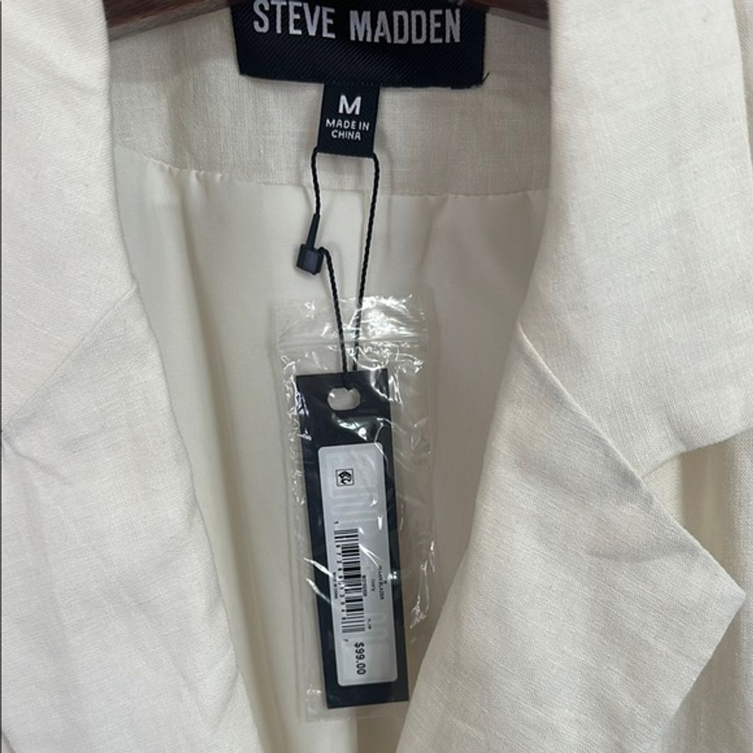 NWT Steve Madden Women's White Linen Blazer  
Key Details:  
Brand: Steve Madden  
Size and Size Locale: M, US  
Department: Women's  
Color: White  
Category: Blazer  
Length: 30.625 inches  
Material: 55% Linen, 45% Viscose  
Care Instructions: Hand wash only  
Origin: Imported  
Pattern: Solid  
Season: Spring/Summer  
Occasion: Casual to formal  
Special Features: Single button closure, easy fit