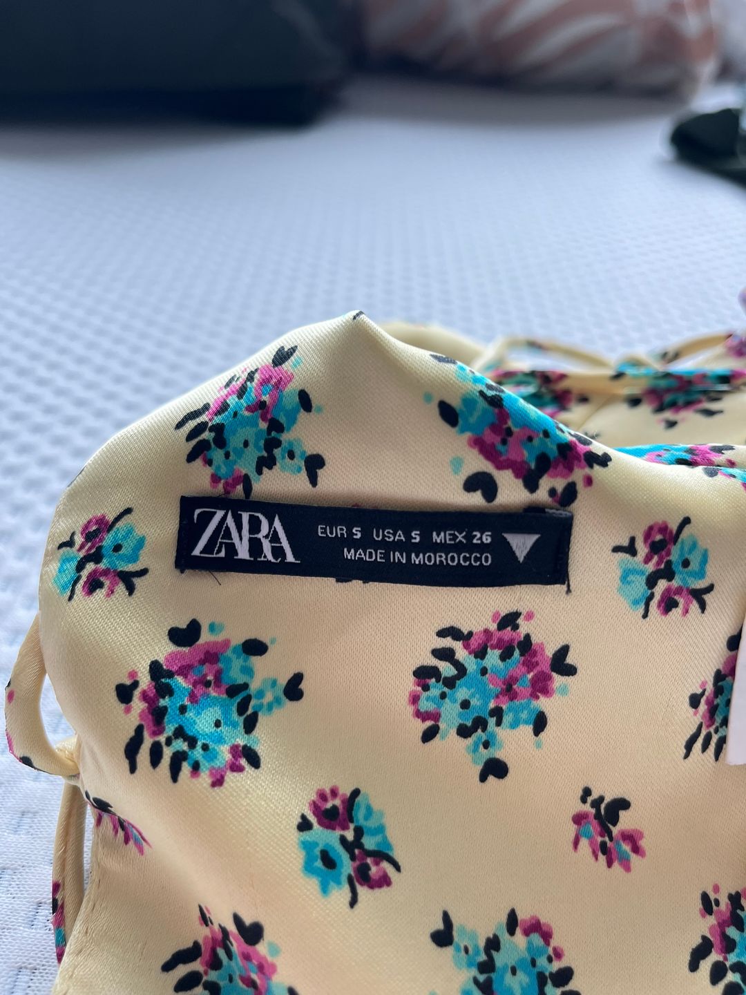 Yellow corset-style top with floral pattern