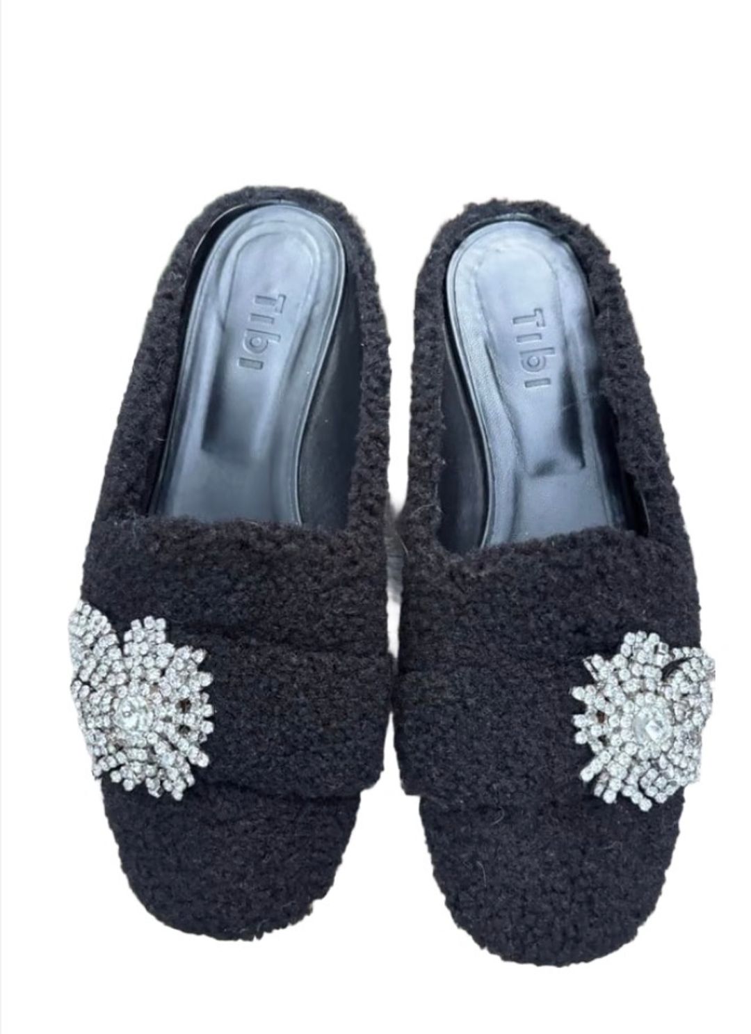 Tibi Alfie Shearling Slides in black, with crystal embellishments. 
