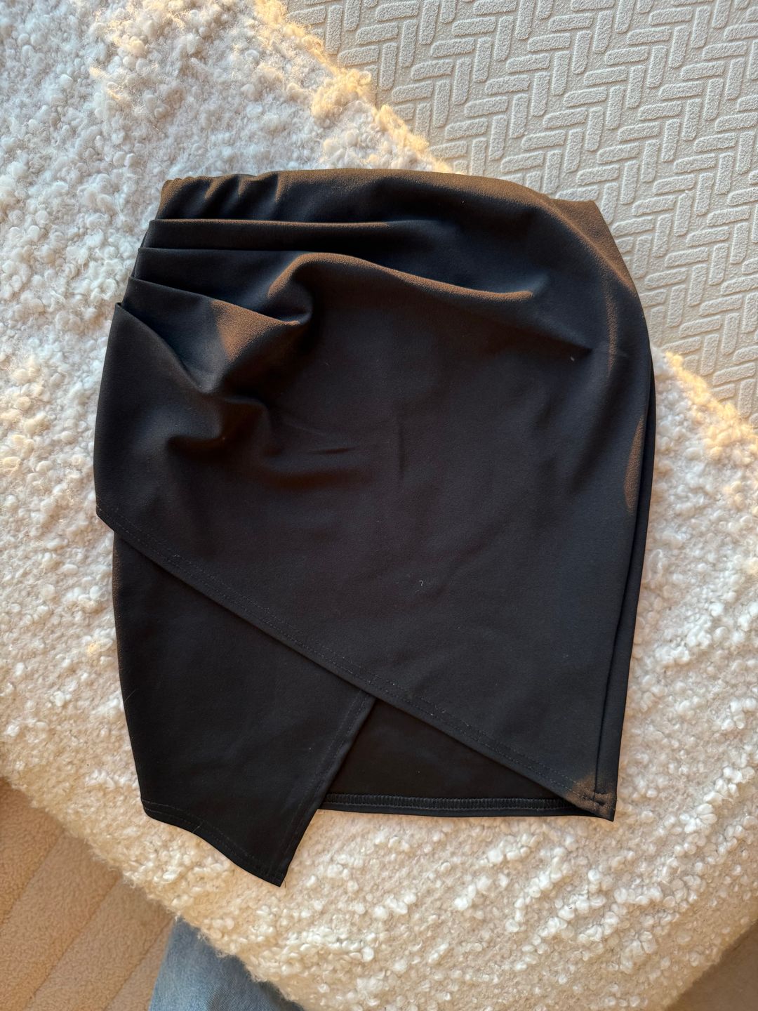 Asymmetrical black mini skirt