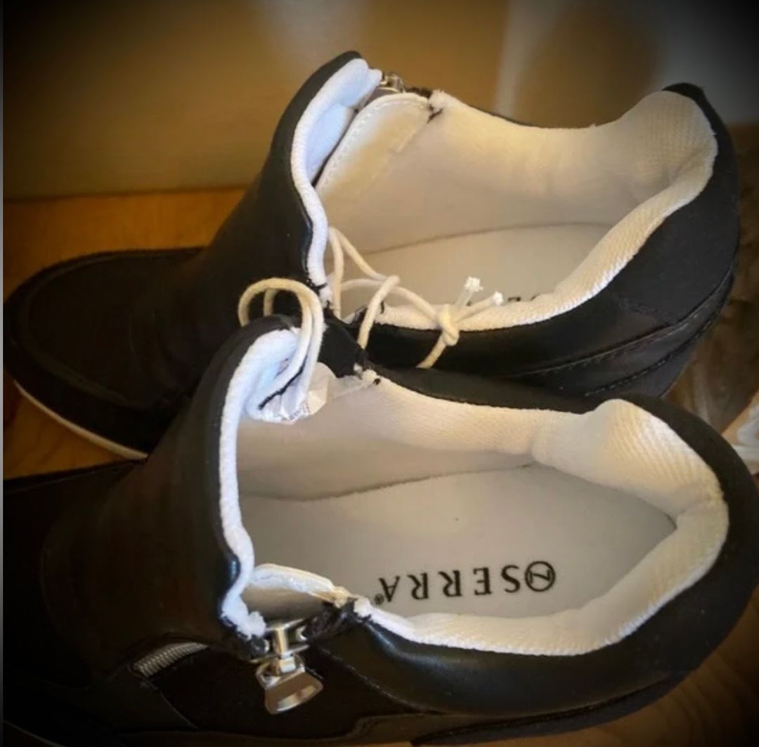 Black zip-up sneakers