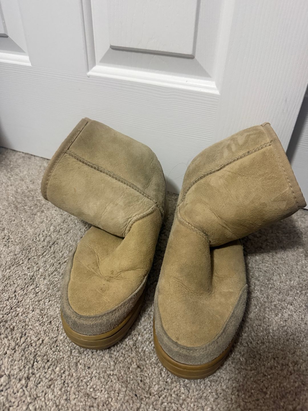 UGG Classic Ultra Mini Platform Boots in the “Sand” / beige suede colorway. chunky gum sole, oversized UGG tread pattern