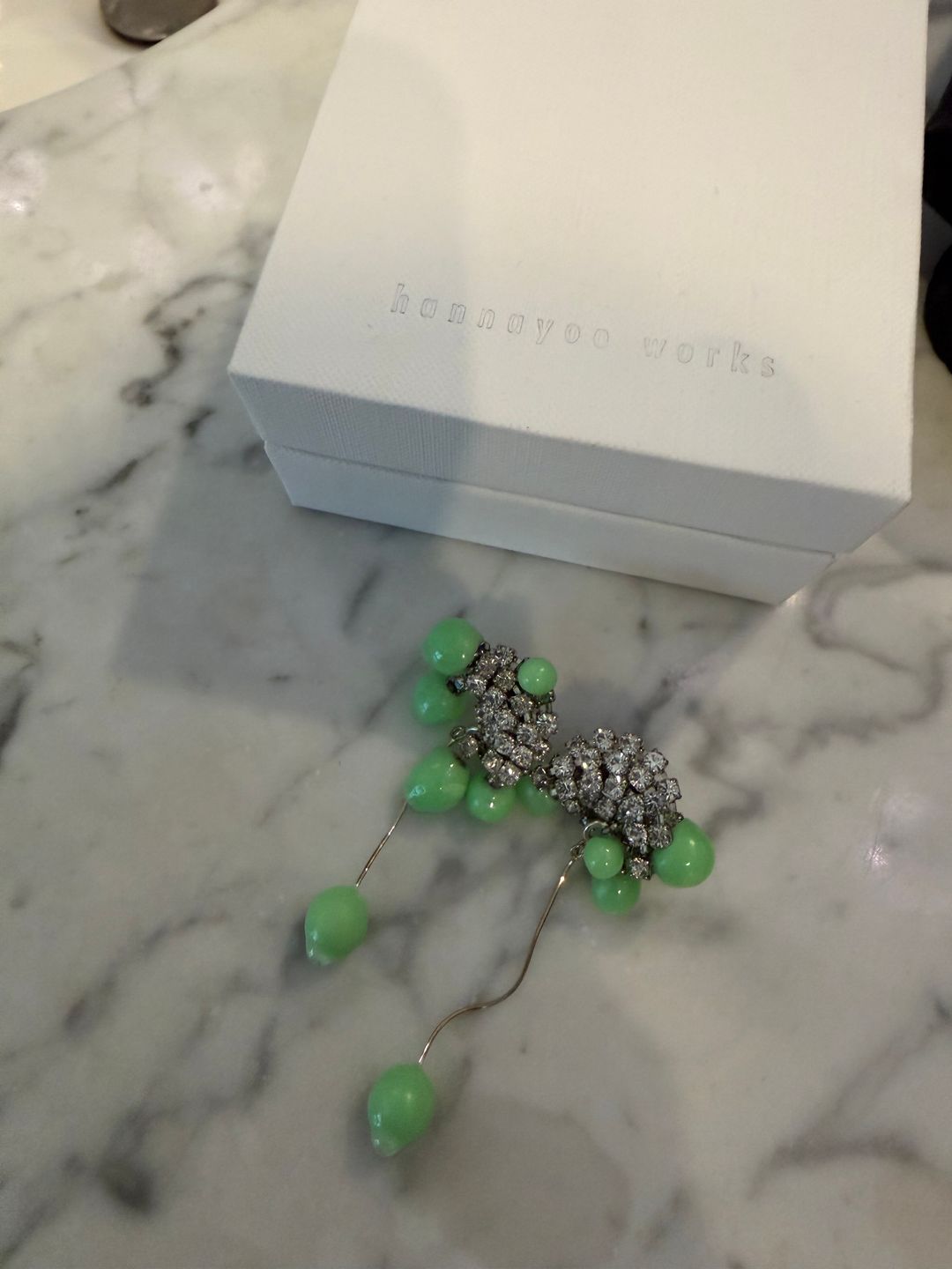 earrings with green and crystal embellishments