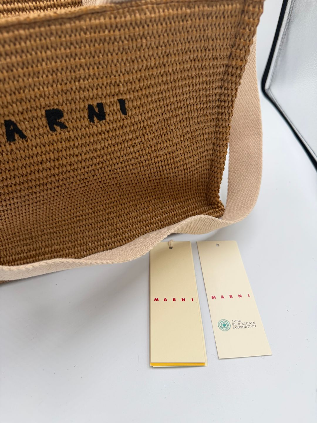 Natural-coloured raffia-effect Small Tote
https://www.marni.com/en-us/shopping-bags-SHMP0077U0P3860Z0R42.html