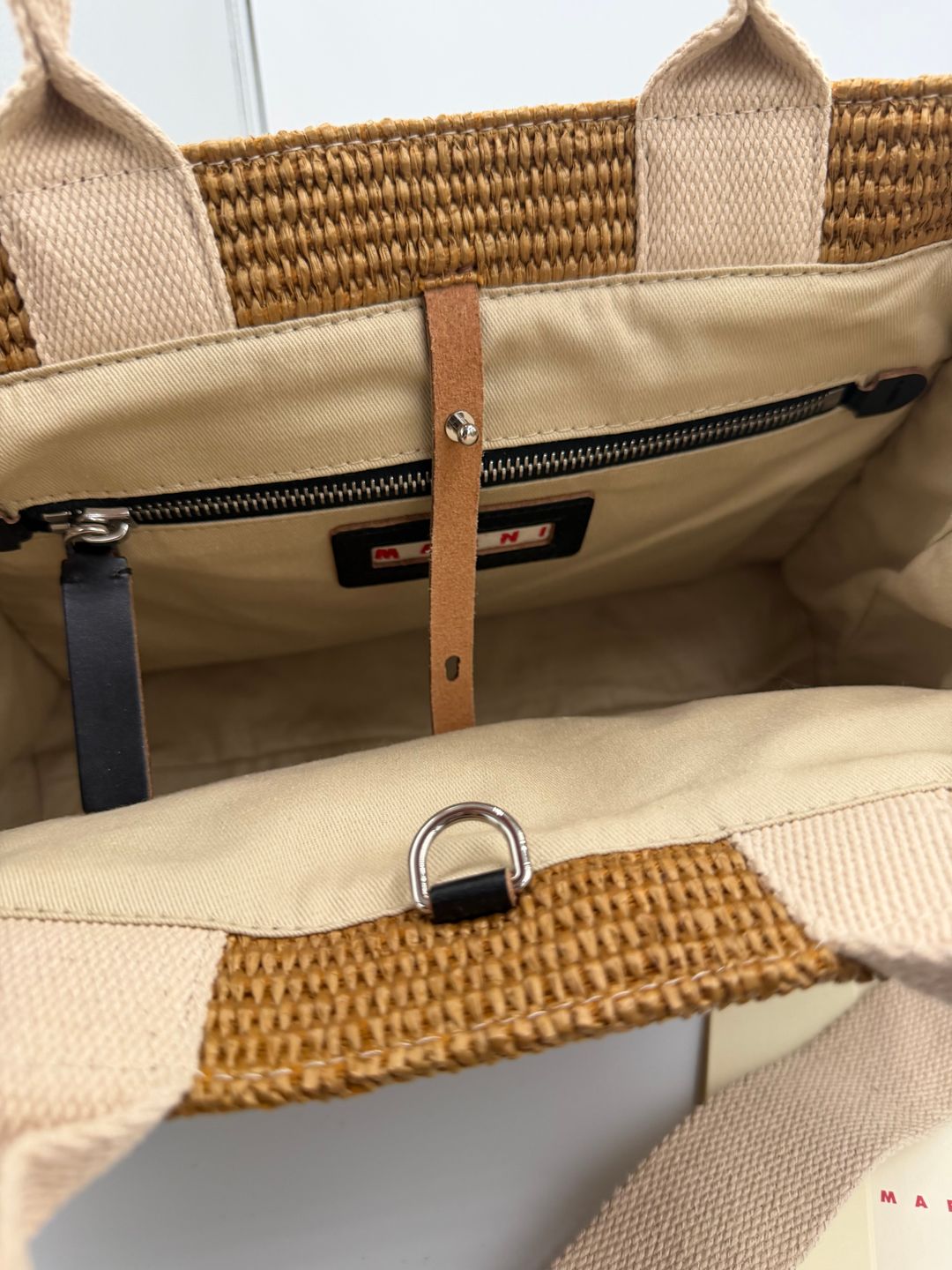 Natural-coloured raffia-effect Small Tote
https://www.marni.com/en-us/shopping-bags-SHMP0077U0P3860Z0R42.html