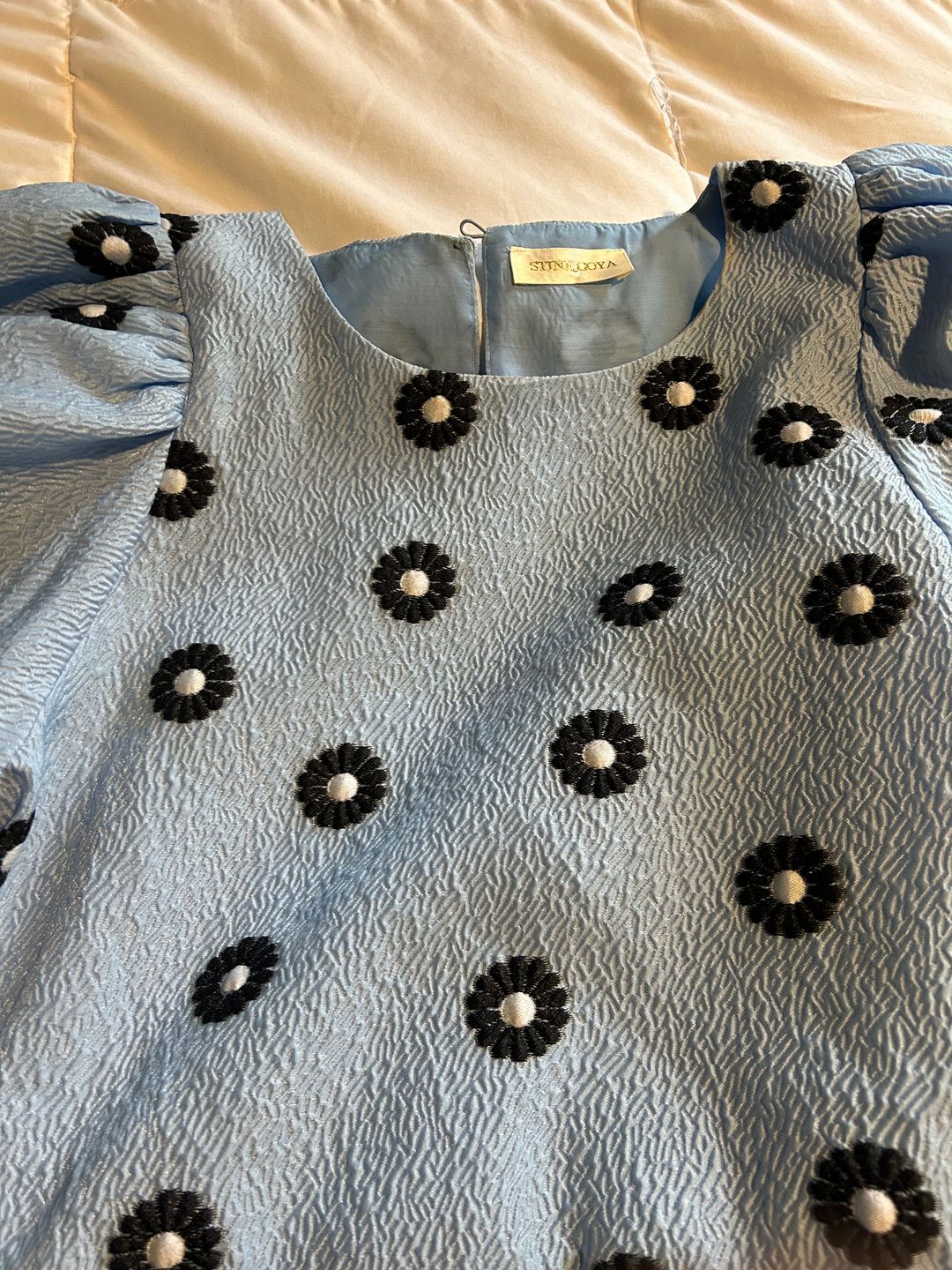 Blue peplum blouse with floral pattern