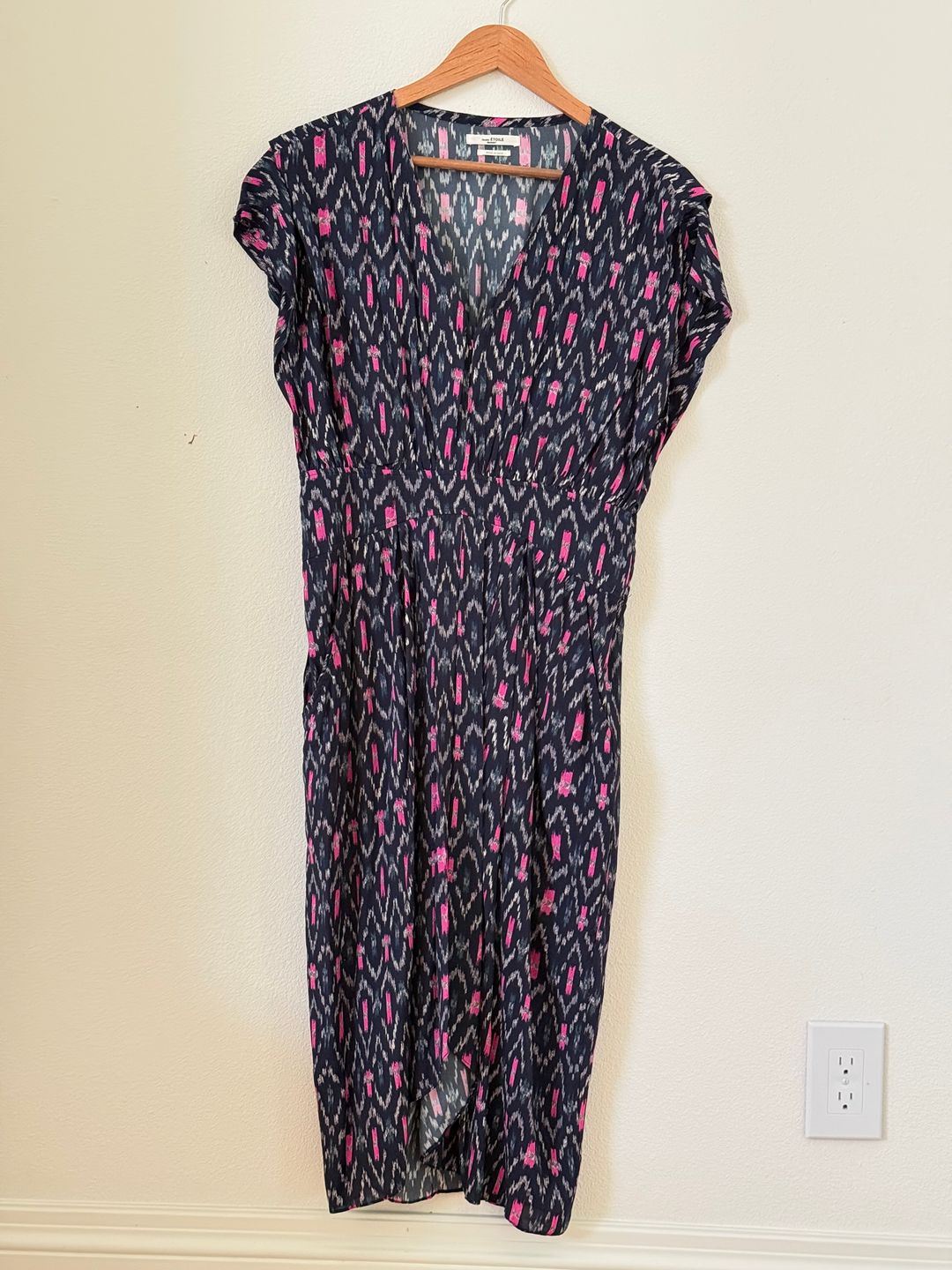 Mid length dress patterned with Ikat print and banded at the waist.