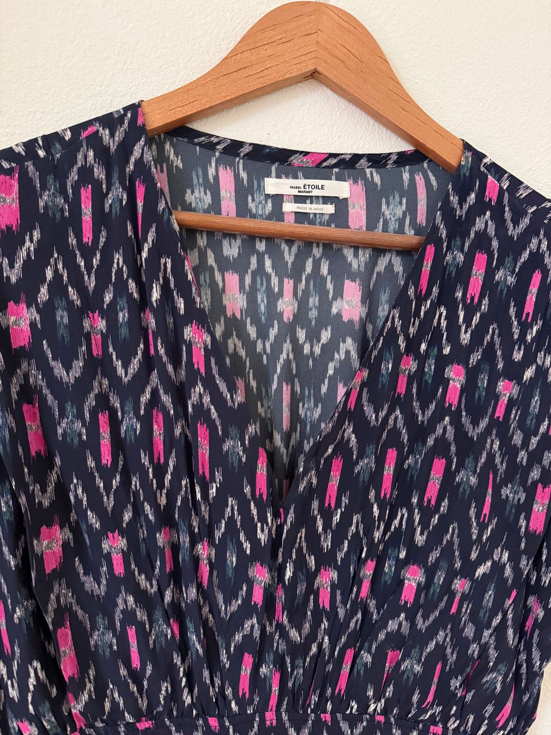 Mid length dress patterned with Ikat print and banded at the waist.