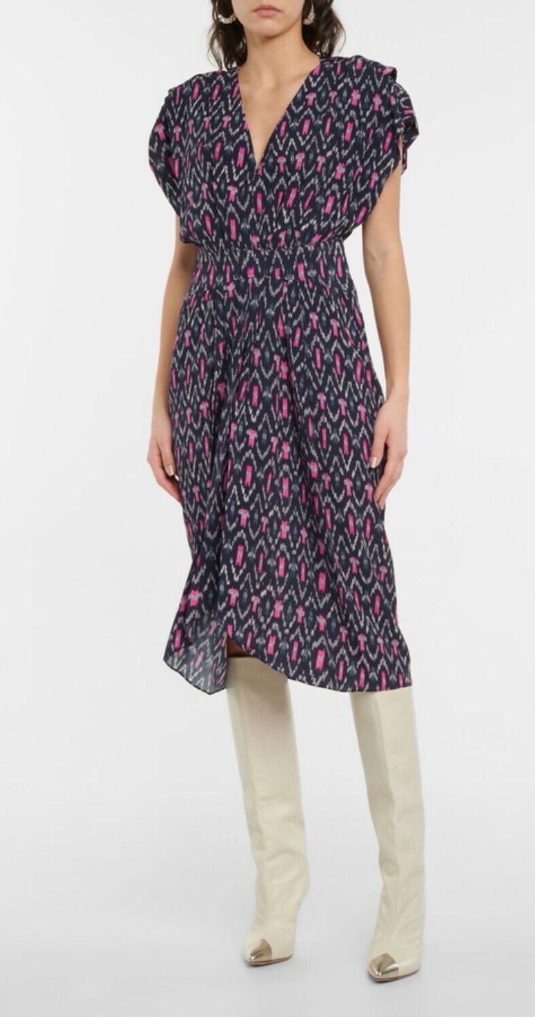 Mid length dress patterned with Ikat print and banded at the waist.