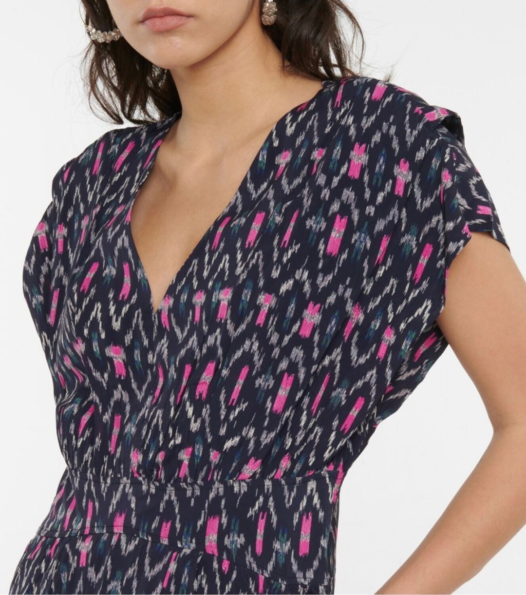Mid length dress patterned with Ikat print and banded at the waist.