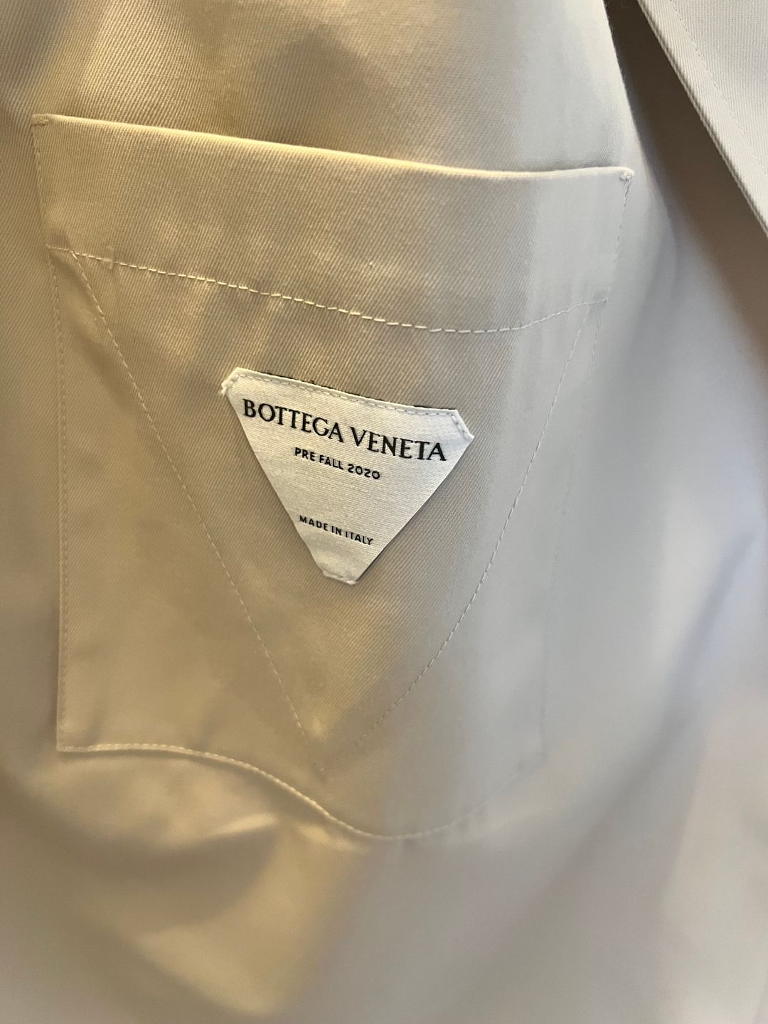 Deconstructed trench coat with layered front flap