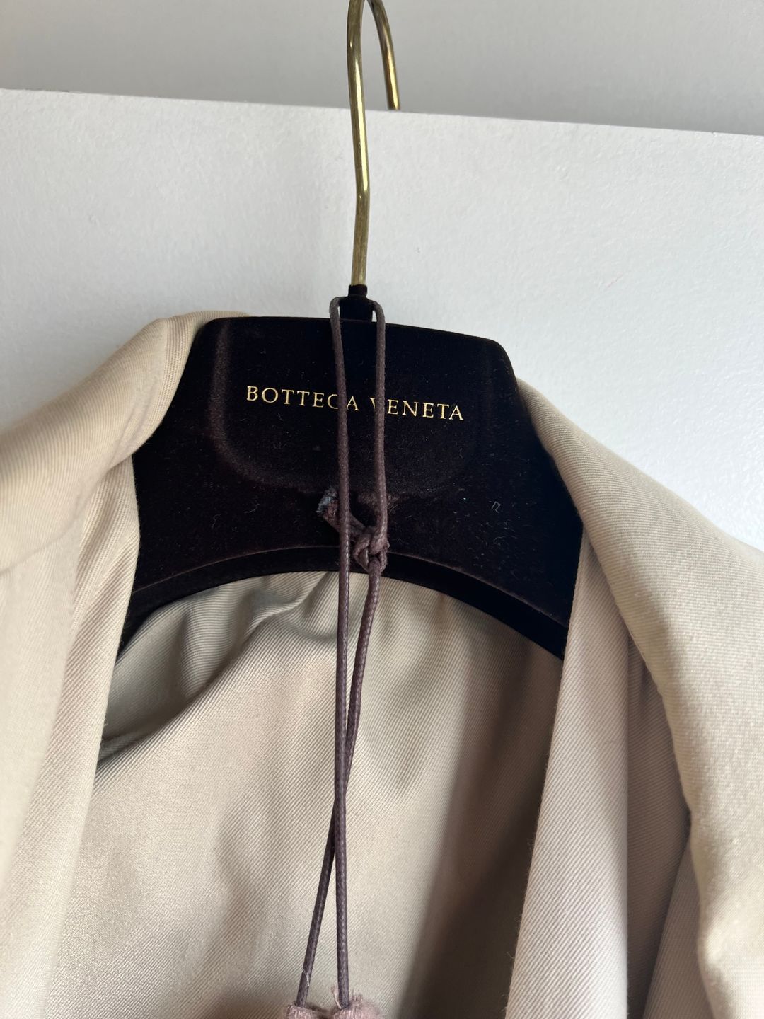 Deconstructed trench coat with layered front flap