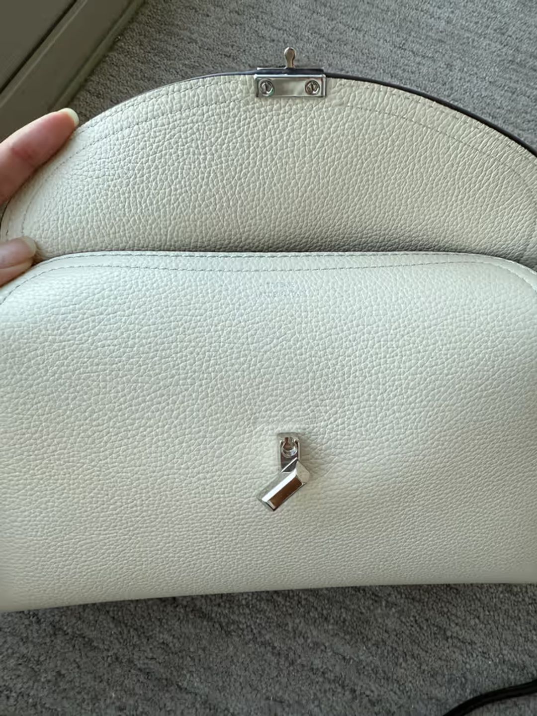 T-Lock grained-leather clutch milk