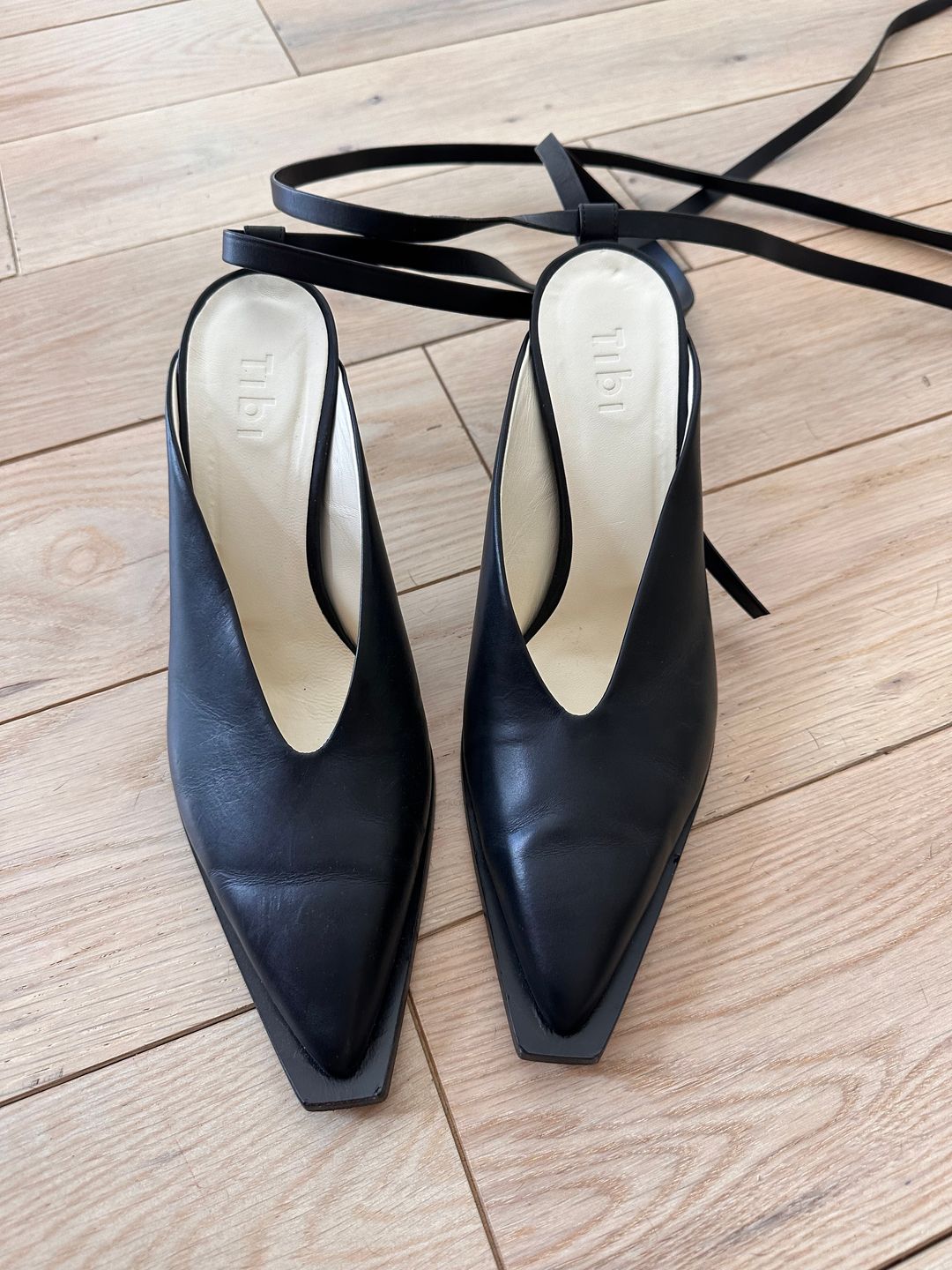 Black leather pumps with ankle ties