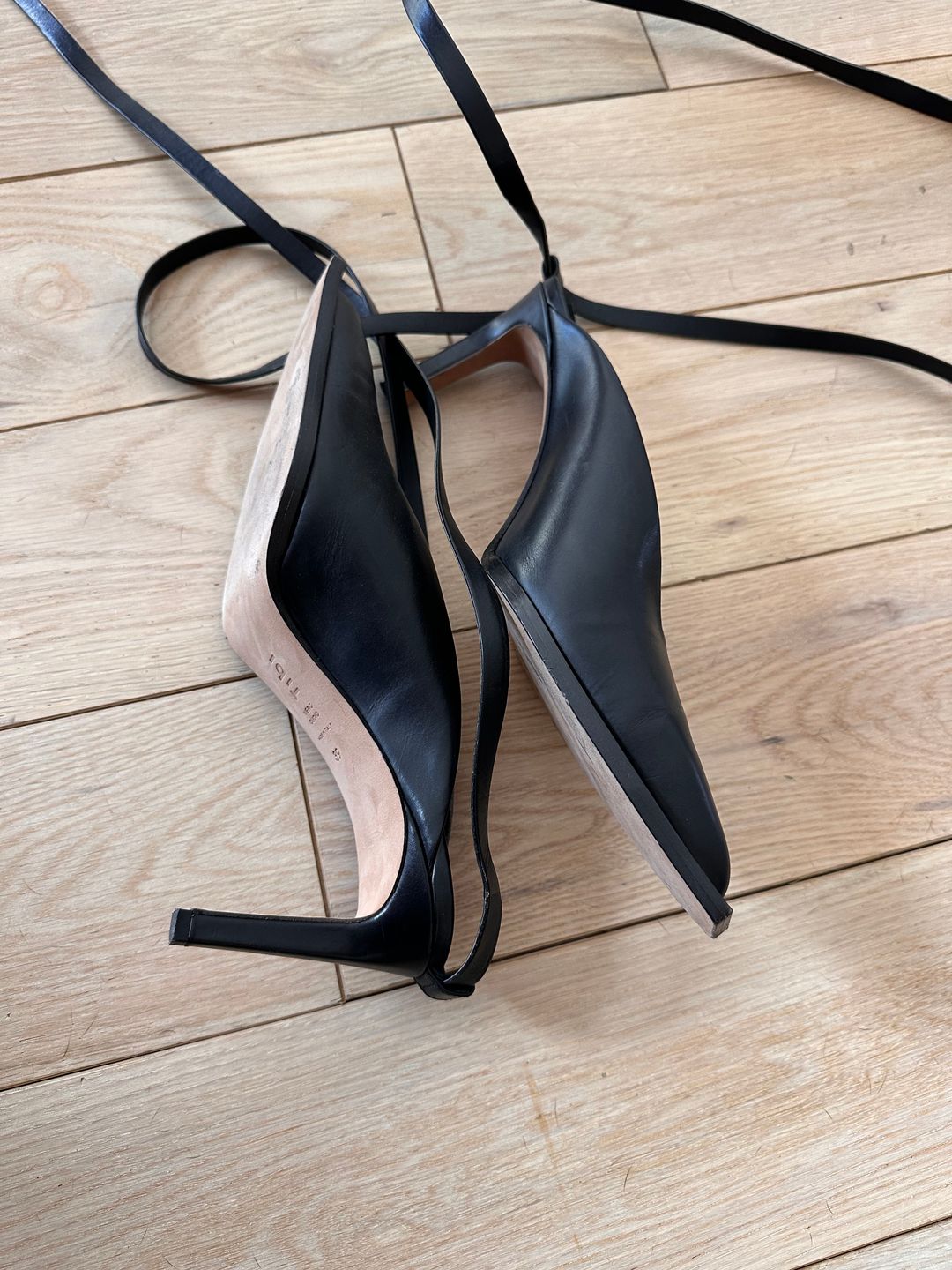 Black leather pumps with ankle ties