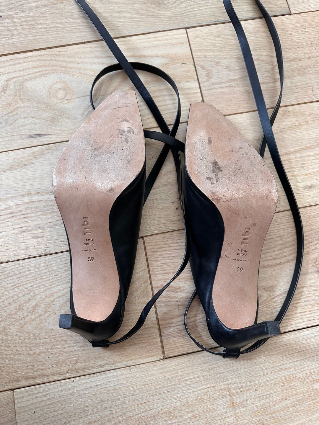 Black leather pumps with ankle ties