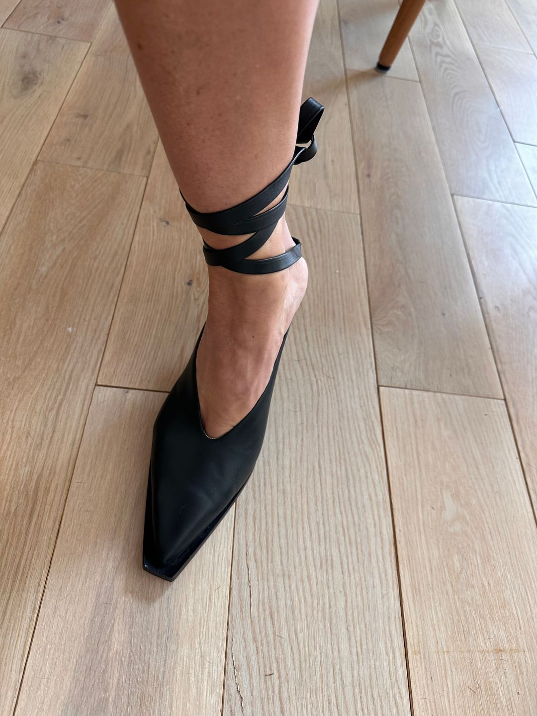 Black leather pumps with ankle ties
