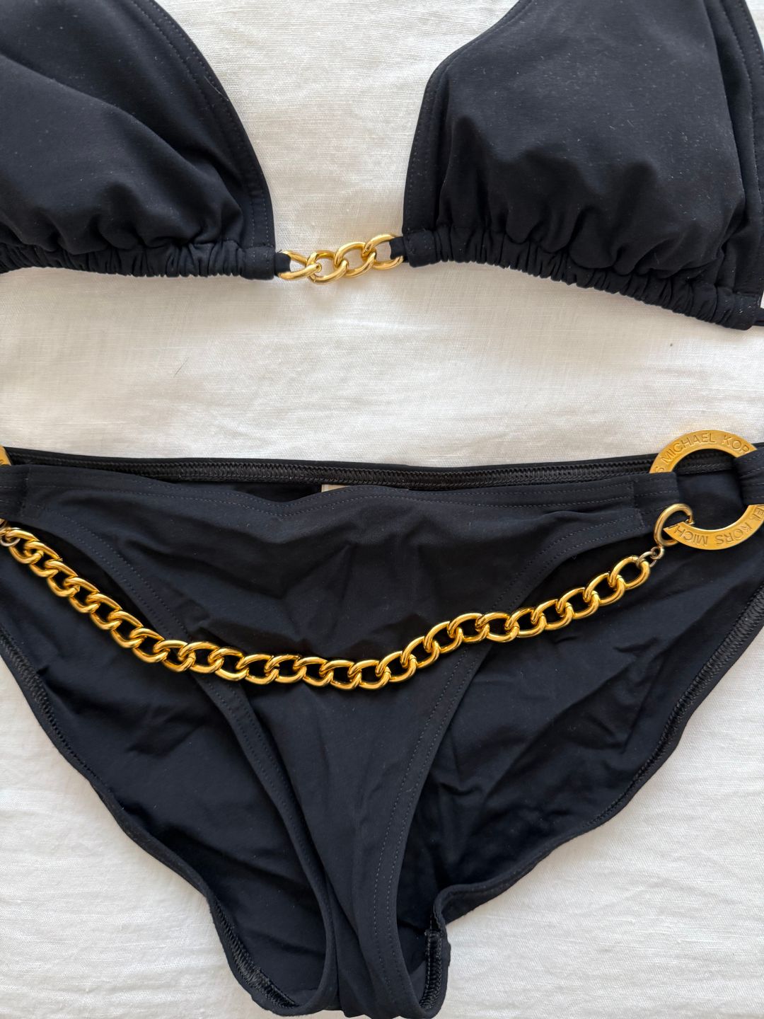 black bikini bottoms with gold chain