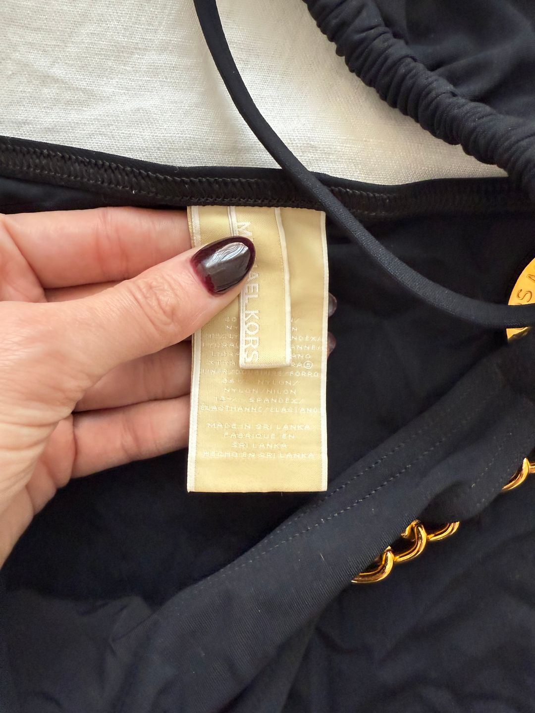 black bikini bottoms with gold chain