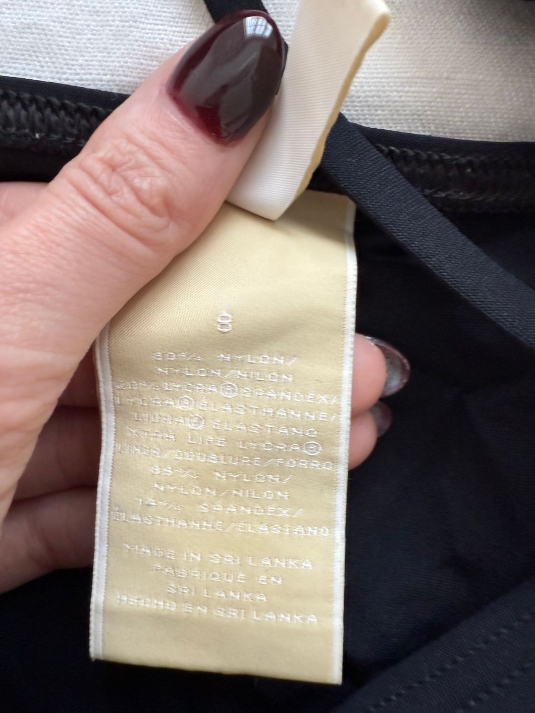 black bikini bottoms with gold chain