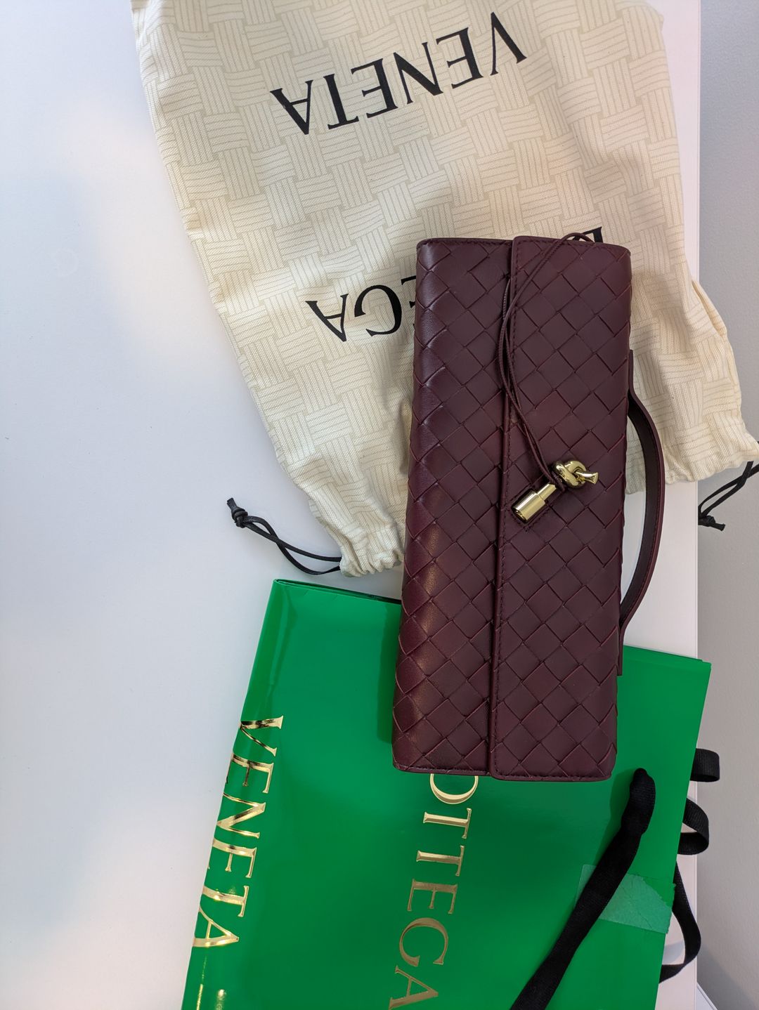 Long Andiamo intrecciato leather clutch