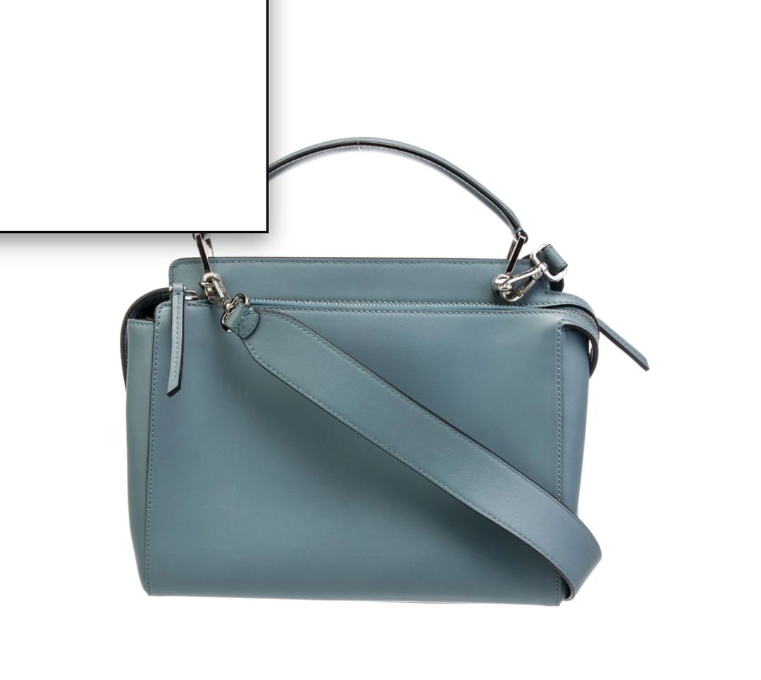 Fendi Fendi Leather Dotcom Medium top handle bag from the 2016 Collection by Karl Lagerfeld. Blue leather with silver-tone hardware. Flat handle and single shoulder strap. Suede lining and dual interior pockets. Zip closure at top. Protective feet at base and INCLUDES DUST BAG. 